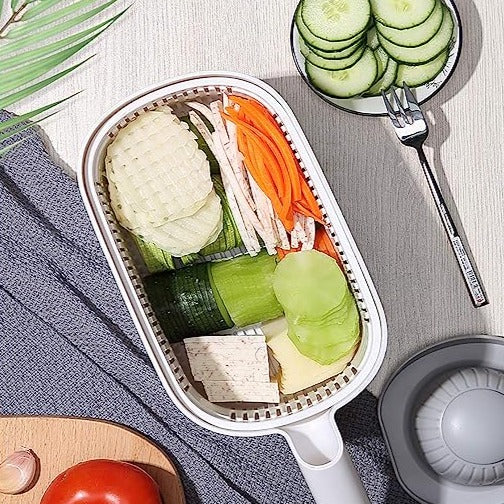 Artifact Vegetable Cutting Shredder.